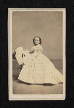 Photograph: M. Lavinia Warren standing in a dress