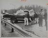 Ambulance attendants moving accident victim onto stretcher, Wethersfield, December 20, 1971