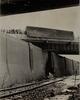 Truck trailer hanging over Founders Bridge guard rail after tipping over, Hartford, February 11, 1971