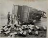 Workers removing spilled gas canister cargo from overturned truck, I-91 exit, October 15, 1971
